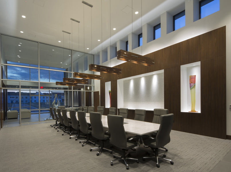 Aeris LED Linear Pendant by Cerno, showing aeris led linear pendants with table & chairs in live shot.
