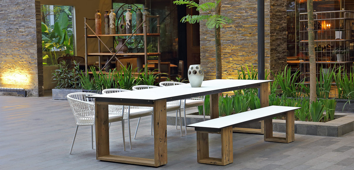 Aiko Dining Table by Mamagreen, showing showing aiko dining table with bench & chairs in live shot.
