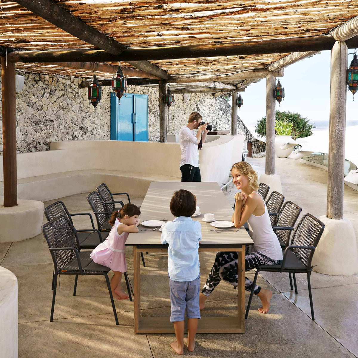 Aiko Dining Table by Mamagreen, showing showing aiko dining table with chairs in live shot.