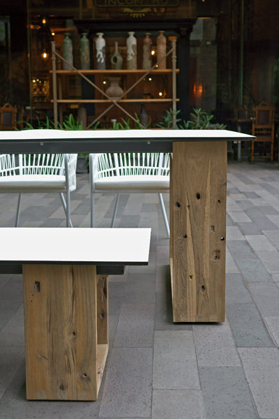 Aiko Dining Table by Mamagreen, showing showing closeup view of aiko dining table with bench & chairs in live shot.