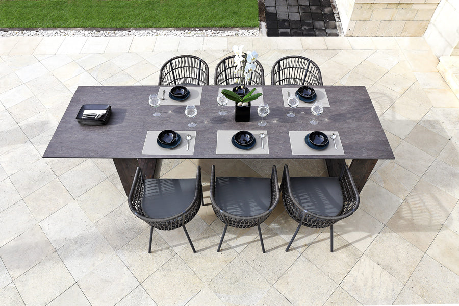 Aiko Dining Table by Mamagreen, showing showing adjusted aiko dining table with chairs in live shot.