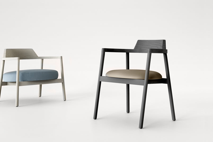 Alek Chair by B&T, showing alek chair with lounge chair in live shot.