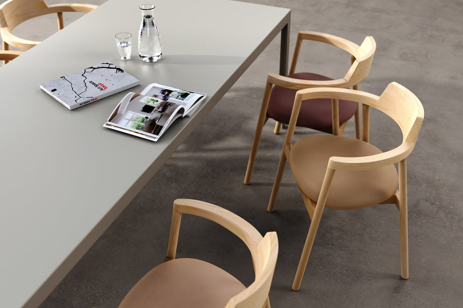 Alek Chair by B&T, showing alek chairs with table in live shot.