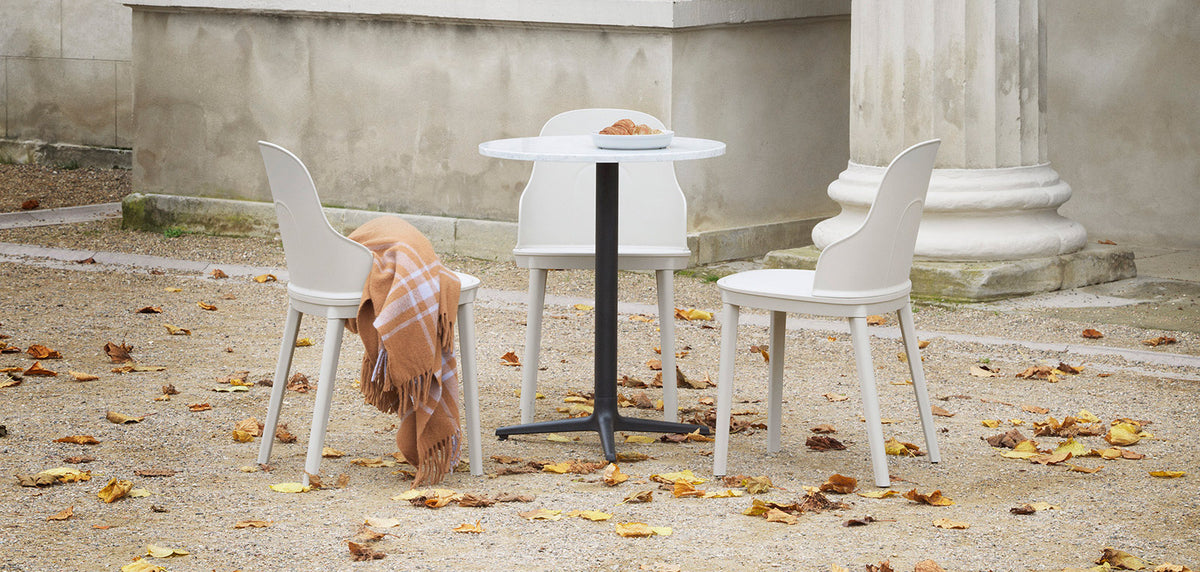 Allez PP Dining Chair by Normann Copenhagen, showing allez pp dining chairs with table in live shot.