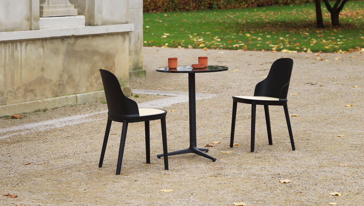 Allez PP Dining Chair Molded Wicker Seat by Normann Copenhagen, showing allez pp dining chairs molded wicker seat with table in live shot.