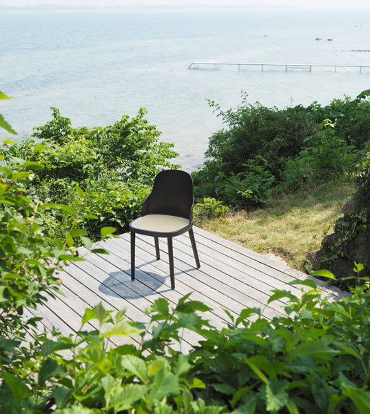 Allez PP Dining Chair Molded Wicker Seat by Normann Copenhagen, showing allez pp dining chair molded wicker seat in live shot.