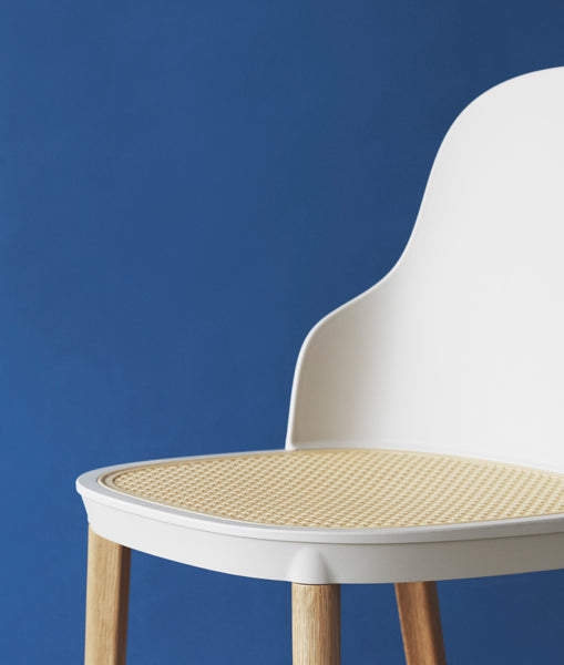 Allez PP Dining Chair Molded Wicker Seat/Oak Legs by Normann Copenhagen, showing closeup view of allez pp dining chair molded wicker seat in live shot.