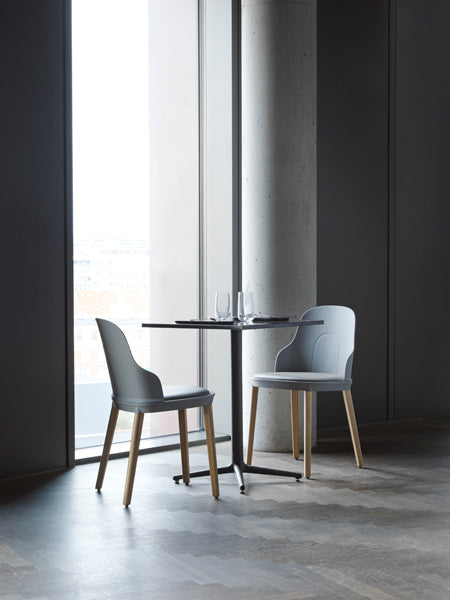 Allez PP Dining Chair Oak Legs by Normann Copenhagen, showing allez pp dining chairs oak legs with table in live shot.
