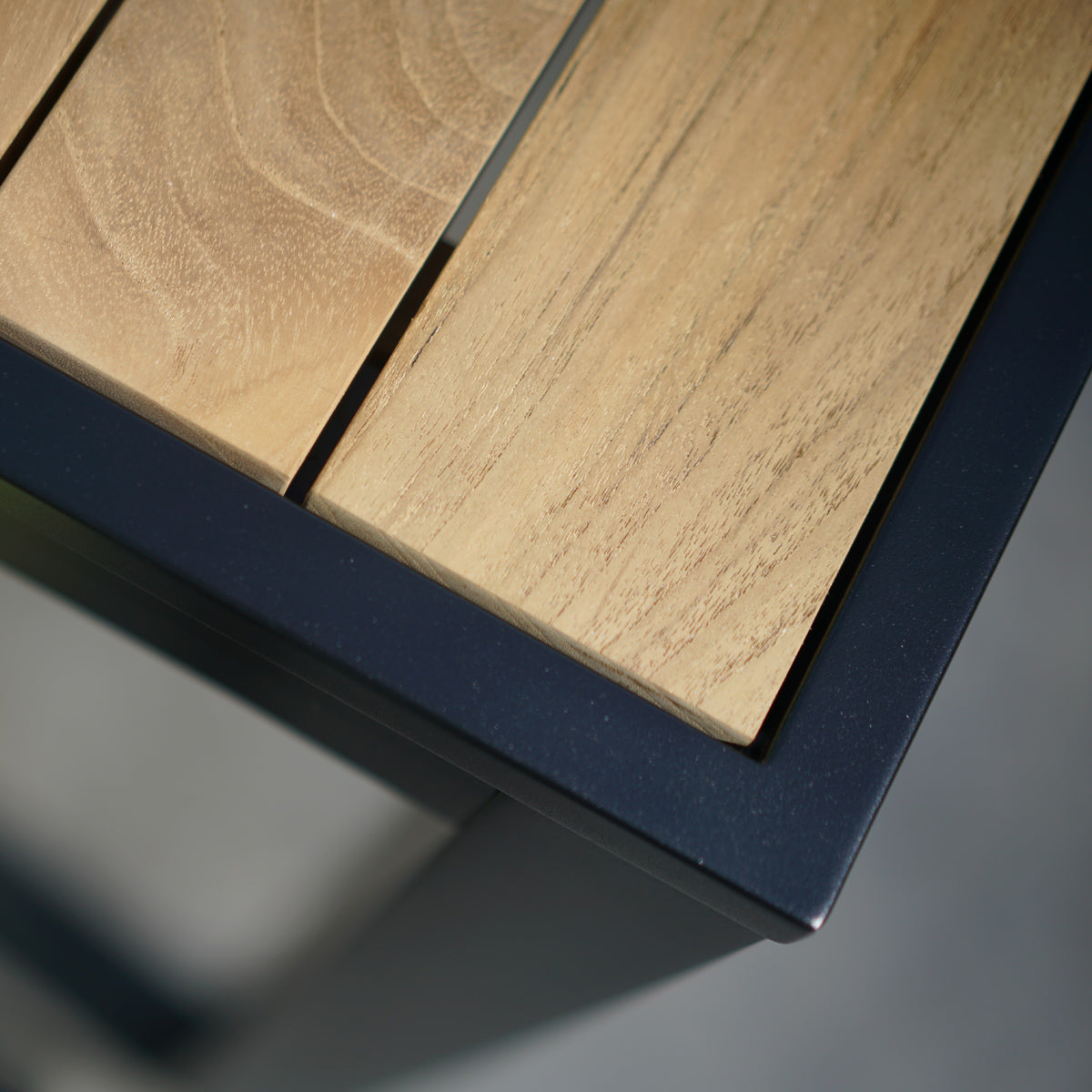 Allux Wood Dining Table by Mamagreen, showing closeup view of allux wood dining table in live shot.