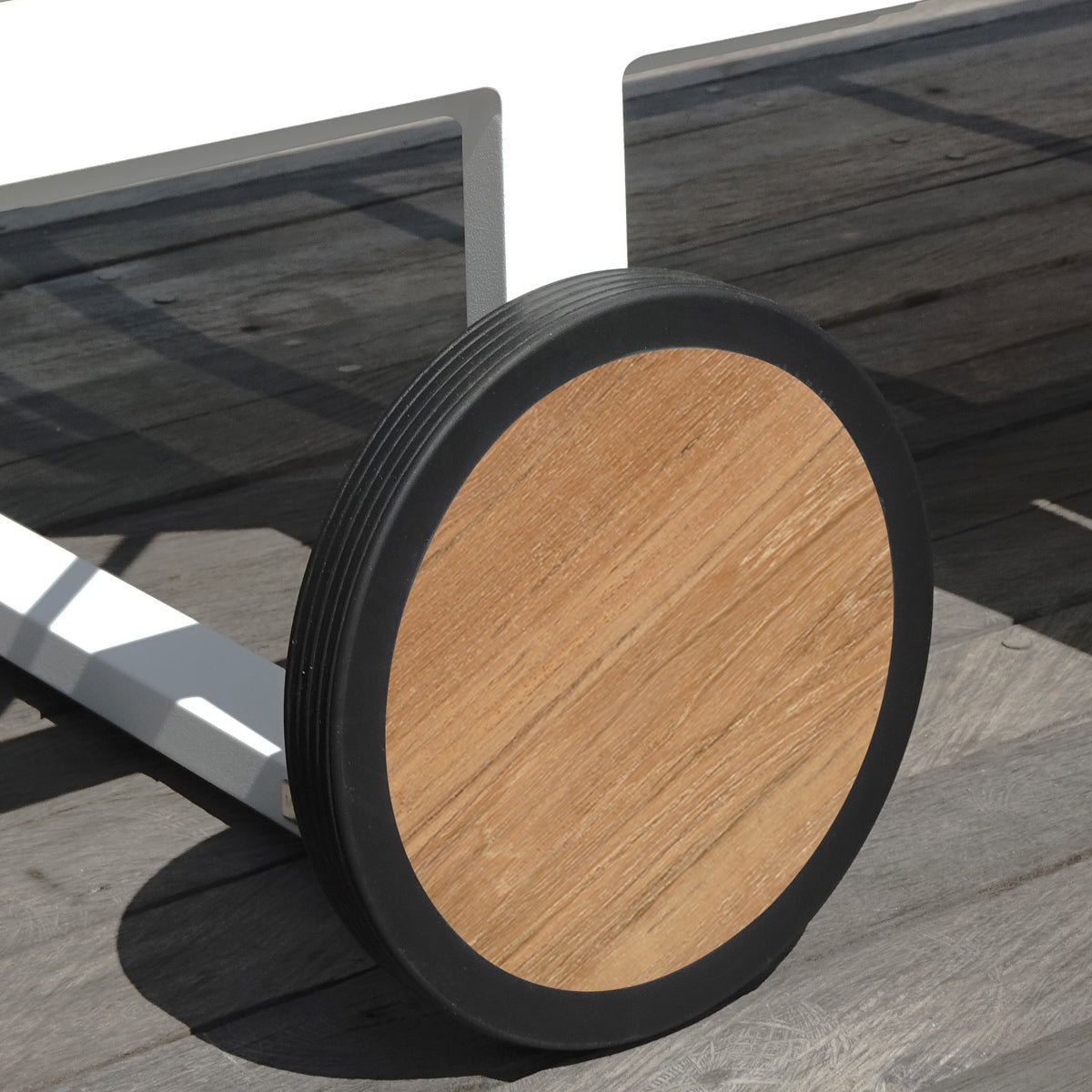 Allux Wooden Wheels Lounger by Mamagreen, showing closeup view of allux wooden wheels lounger in live shot.