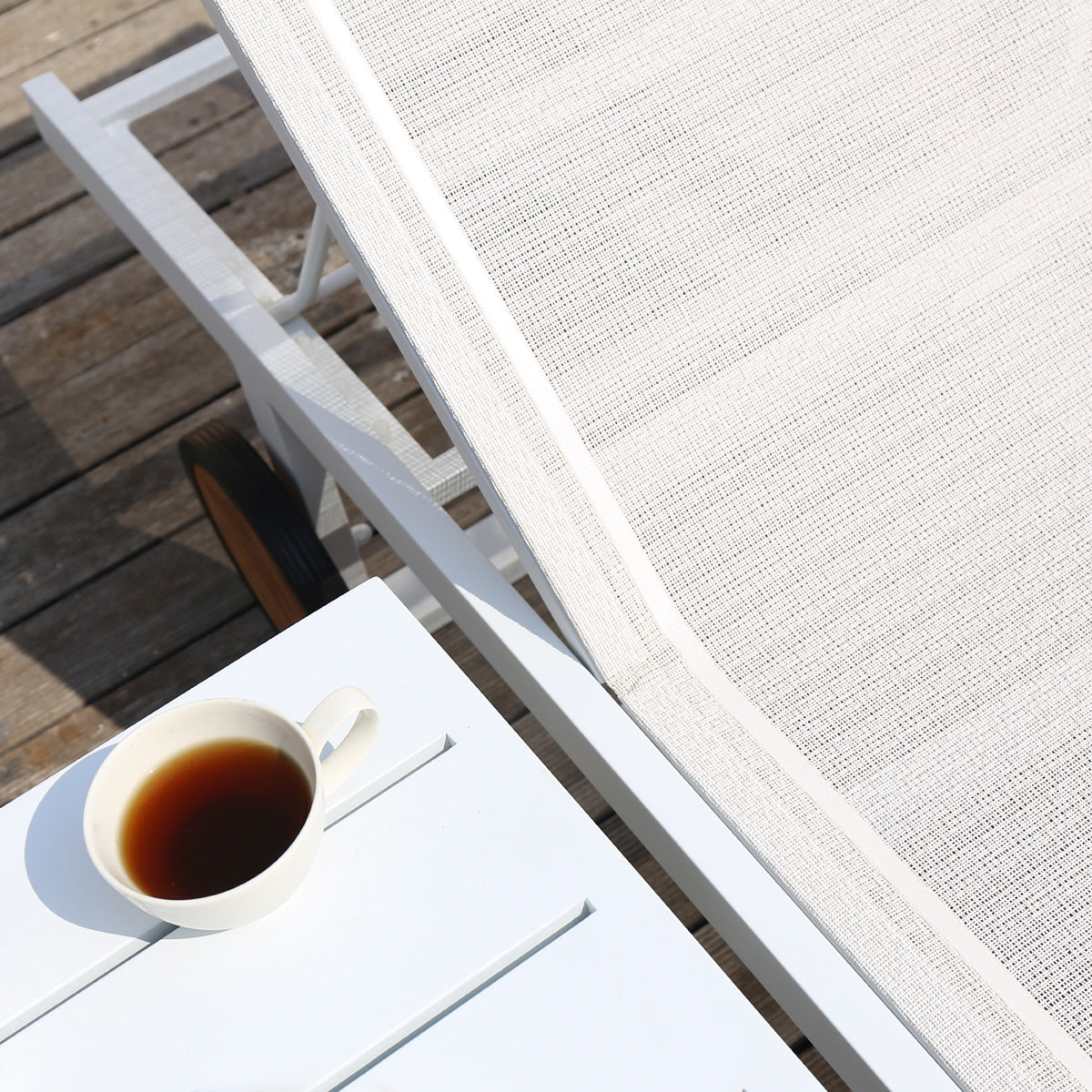 Allux Wooden Wheels Lounger by Mamagreen, showing closeup view of allux wooden wheels lounger in live shot.
