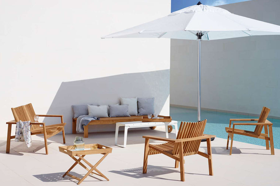 Amaze Stackable Lounge Chair by Cane-Line, showing amaze stackable lounge chairs in live shot.