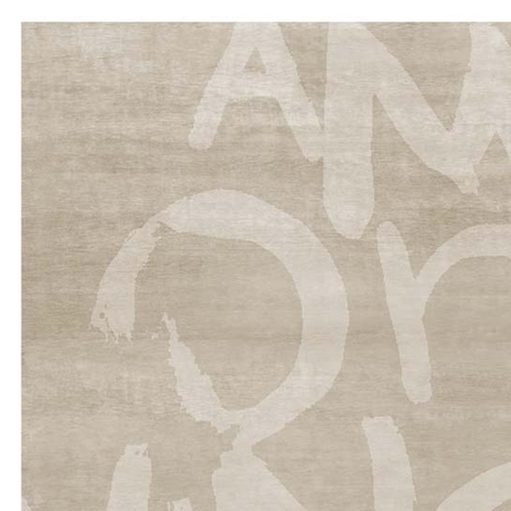 Amor Vincit Omnia AA125 Rug by Second Studio, showing closeup view of amor vincit omnia AA125 rug by second studio in sand.