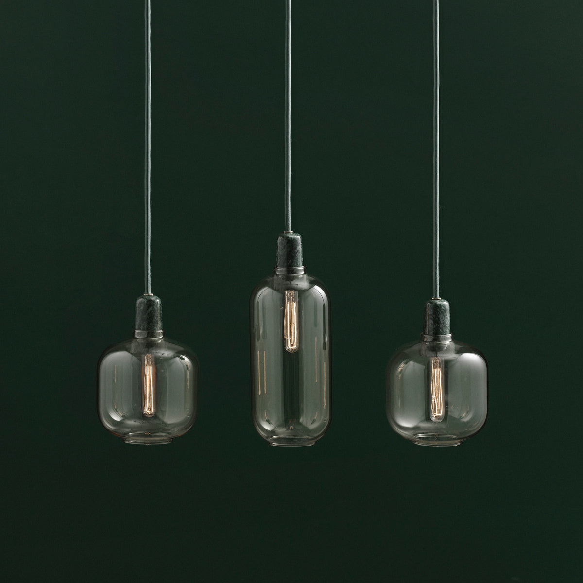 Amp Canopy by Normann Copenhagen, showing amp pendants for amp canopy in live shot.