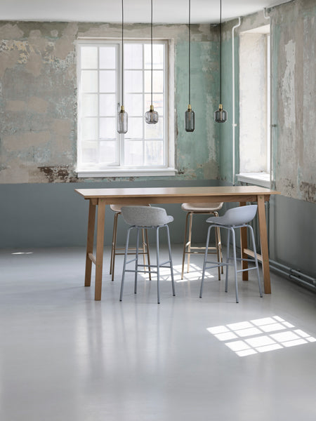 Amp Canopy by Normann Copenhagen, showing amp pendants for amp canopy in live shot.