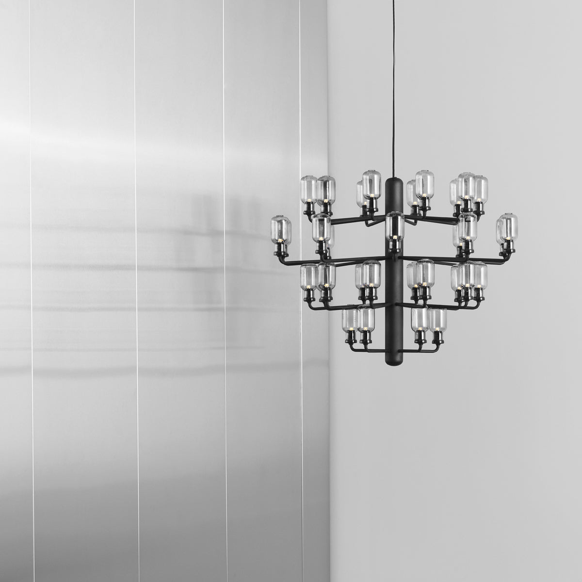 Amp US Chandelier by Normann Copenhagen, showing amp us chandelier in live shot.