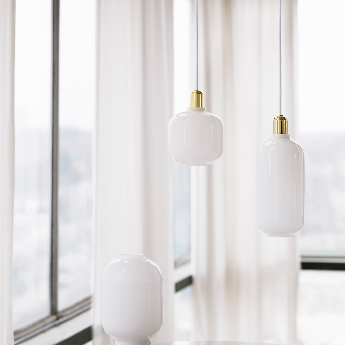 Amp US Pendant Lamp by Normann Copenhagen, showing amp us pendant lamps in live shot.