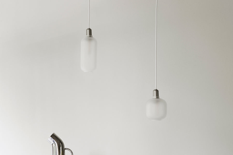 Amp US Pendant Lamp by Normann Copenhagen, showing amp us pendant lamps in live shot.