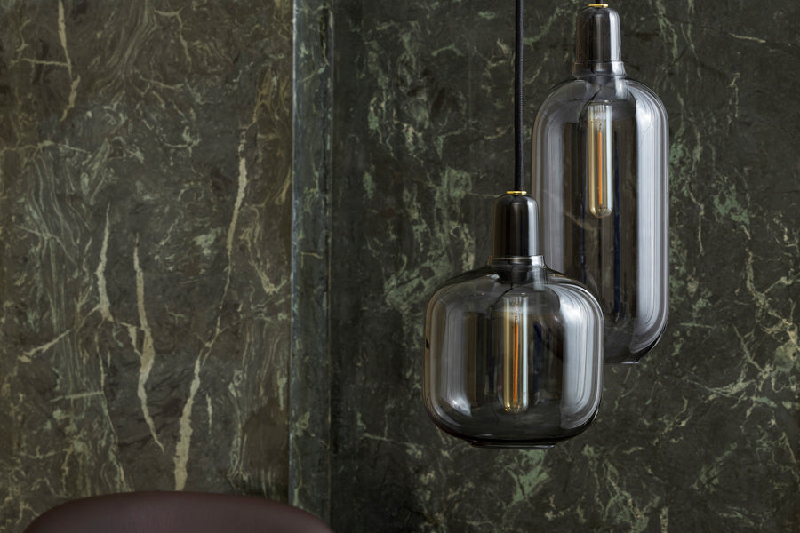 Amp US Pendant Lamp by Normann Copenhagen, showing amp us pendant lamps in live shot.