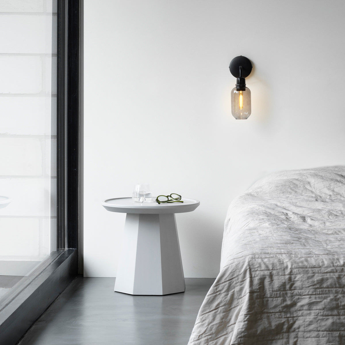 Amp US Wall Lamp by Normann Copenhagen, showing amp us wall lamp in live shot.