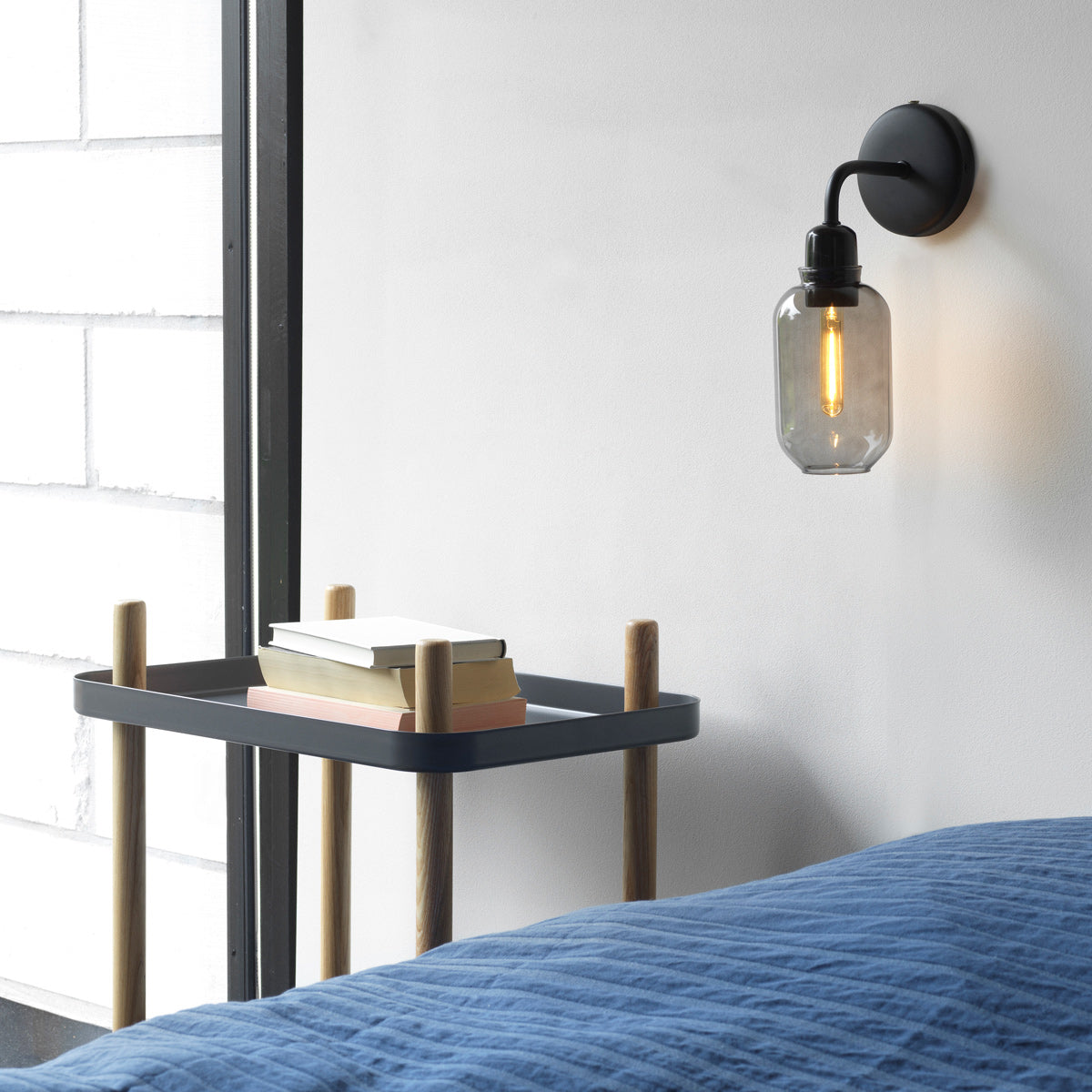 Amp US Wall Lamp by Normann Copenhagen, showing amp us wall lamp in live shot.