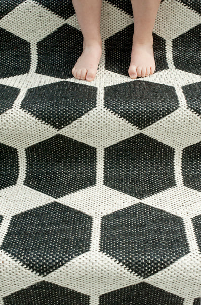 Anna Woven Plastic Rug by Brita, showing closeup view of anna woven plastic rug in live shot.