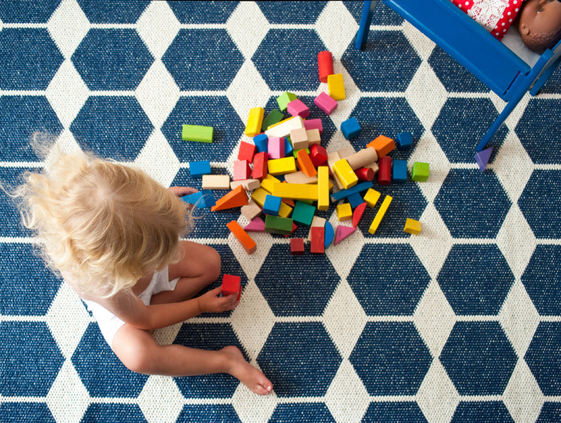 Anna Woven Plastic Rug by Brita, showing closeup view of anna woven plastic rug in live shot.