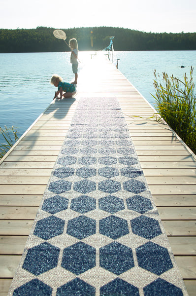Anna Woven Plastic Rug by Brita, showing anna woven plastic rug in live shot.