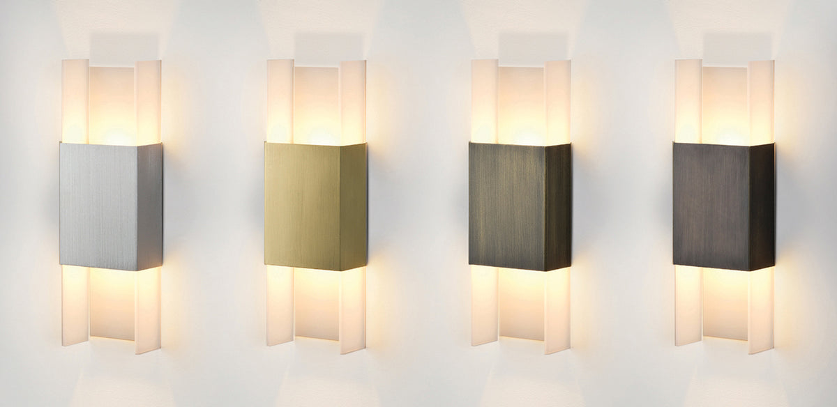 Ansa LED Sconce by Cerno, showing angle view of ansa led sconces in brushed aluminum, brushed brass, distressed brass and oiled bronze.