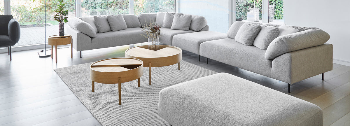 Arc Coffee Table by Woud, showing arc coffee tables in live shot.