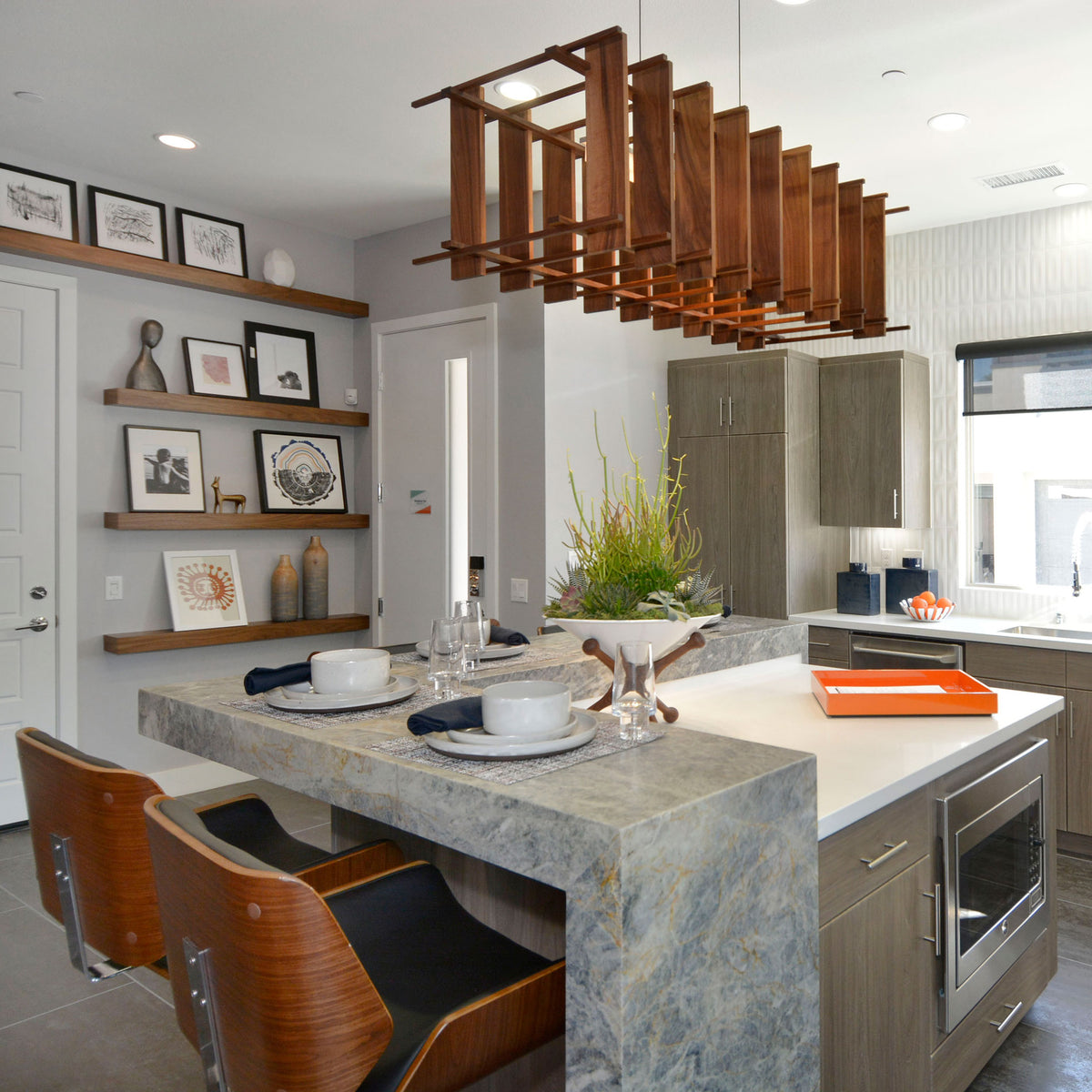 Arca LED Linear Pendant by Cerno, showing arca led linear pendant with stools in live shot.