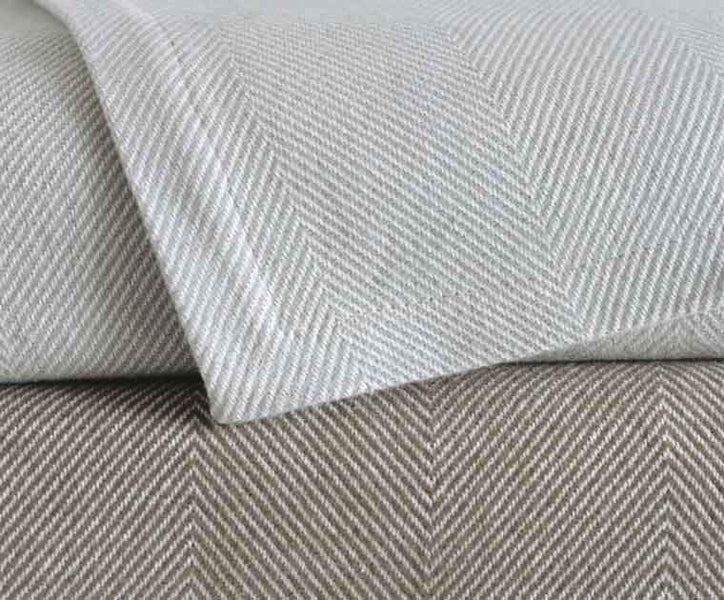Harry Cotton Blankets by Area, showing white & almond blanket in live shot.
