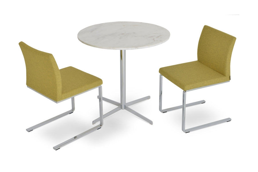 Aria Flat Chair by SohoConcept, showing angle view of the chair with table.