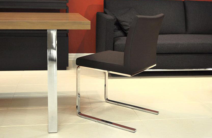 Aria Flat Chair by SohoConcept, showing flat chair with table in live shot.