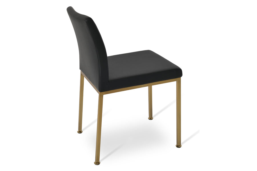 Aria Metal Adjuster Cap Chair by SohoConcept, showing side view of aria metal adjuster cap chair in brass/black leatherette.