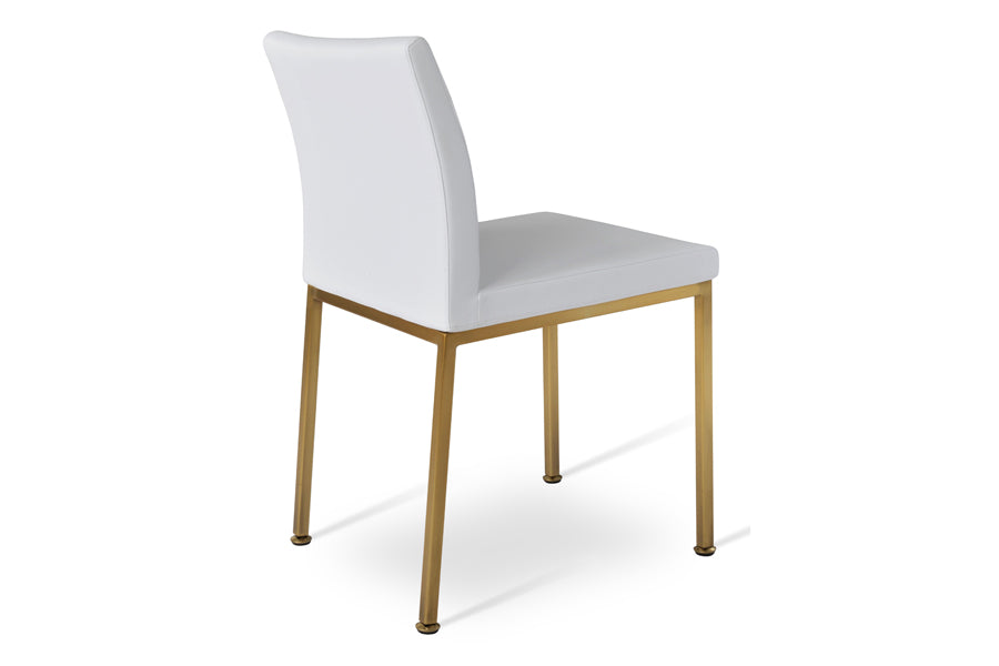 Aria Metal Adjuster Cap Chair by SohoConcept, showing side view of aria metal adjuster cap chair in brass/white leatherette.