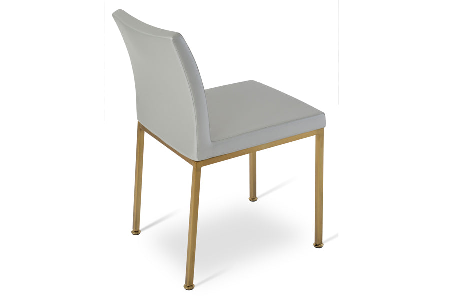 Aria Metal Adjuster Cap Chair by SohoConcept, showing side view of aria metal adjuster cap chair in brass/silver ppm.
