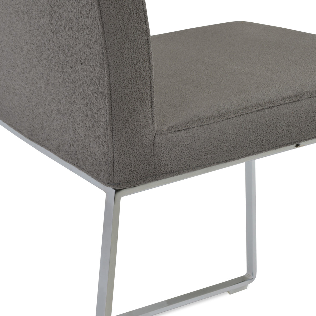 Aria Sled Wire Dining Chair by SohoConcept, showing closeup view of sleg dining chair.