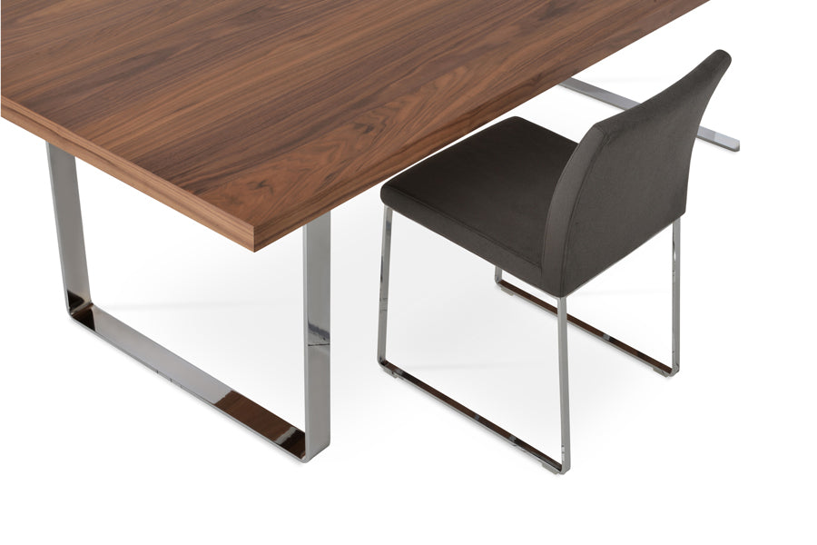 Aria Sled Wire Dining Chair by SohoConcept, showing closeup view of sleg dining chair with table.