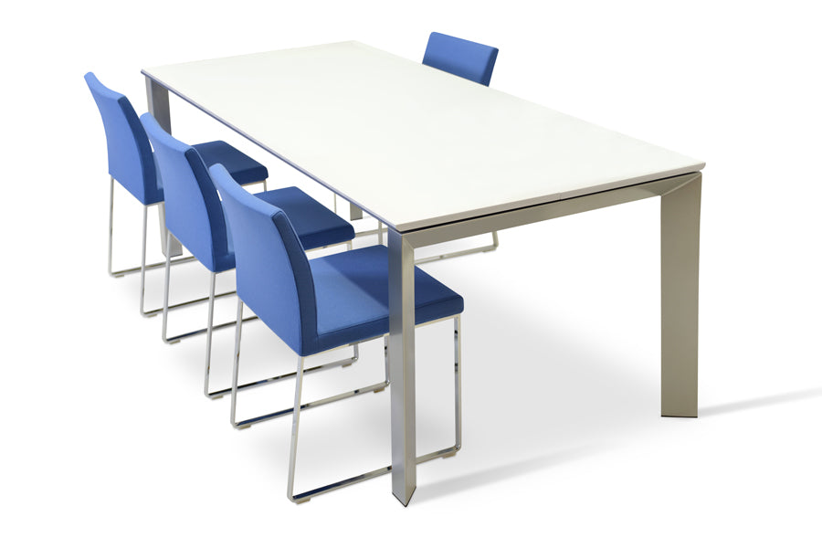 Aria Sled Wire Dining Chair by SohoConcept, showing sleg dining chairs with table.
