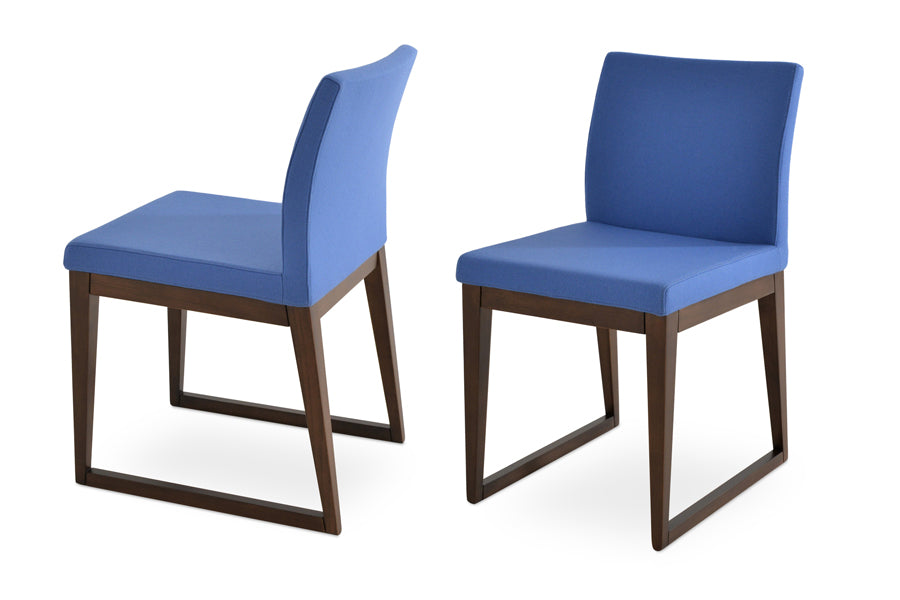 Aria Sled Wood Dining Chair by SohoConcept, showing two sled wood chairs in camira blazer skyblue wool.