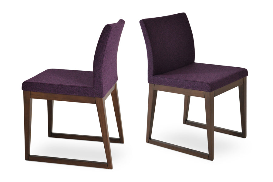Aria Sled Wood Dining Chair by SohoConcept, showing two sled wood chairs in camira blazer deep maroon wool.