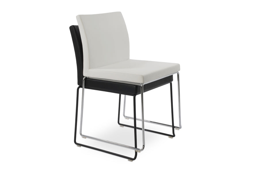 Aria Stackable Dining Chair by sohoConcept, shown in black & white leatherette.
