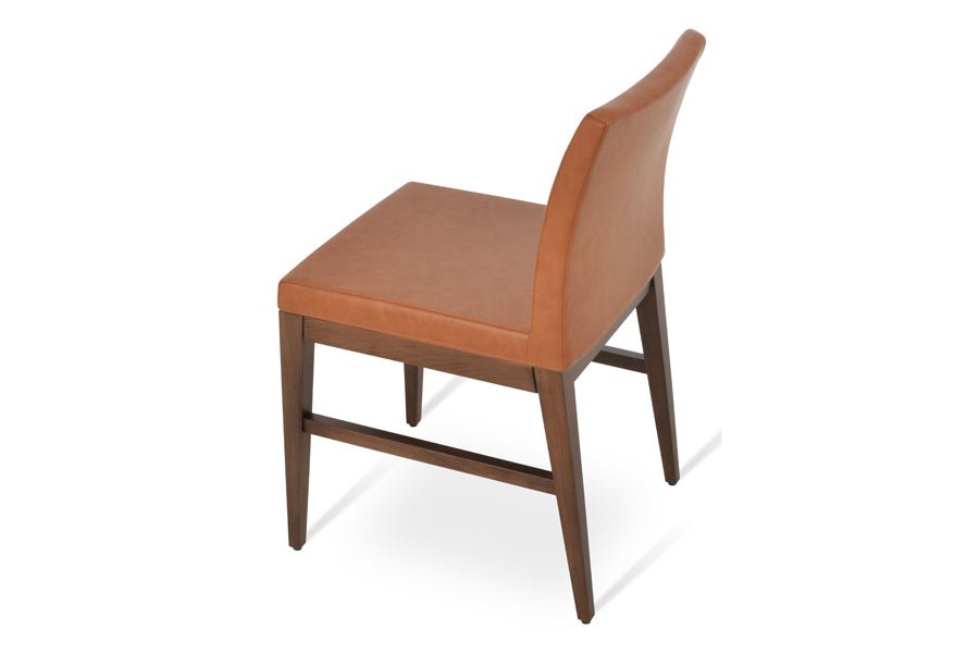 Aria Wood Stretcher Dining Chair by SohoConcept, showing side view of aria wood stretcher dining chair in beech walnut wood/caramel ppm.