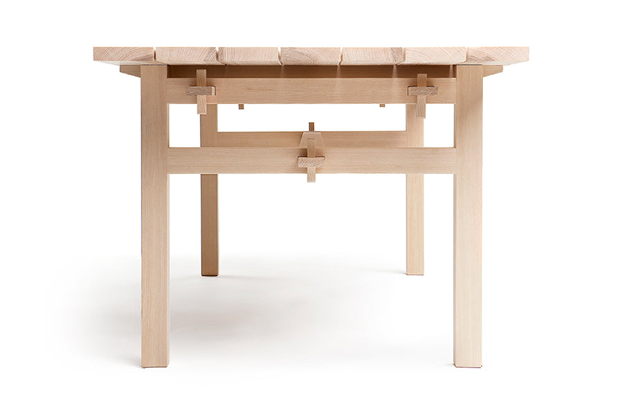 Arkipelago KVP10 Indoor Table by Nikari, showing side view of arkipelago kvp10 indoor table in ash wood.