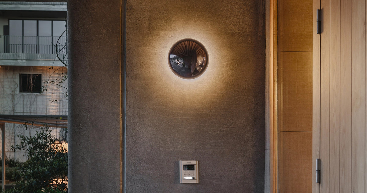 Babila Outdoor Wall Sconce by Marset, showing babila outdoor wall sconce in live shot.