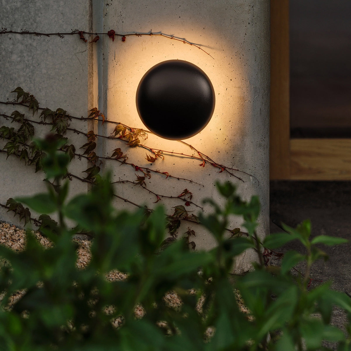 Babila Outdoor Wall Sconce by Marset, showing babila outdoor wall sconce in live shot.