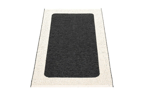 Ilda Black & Vanilla Runner Rug by Pappelina, showing back view of ilda black & vanilla runner rug.