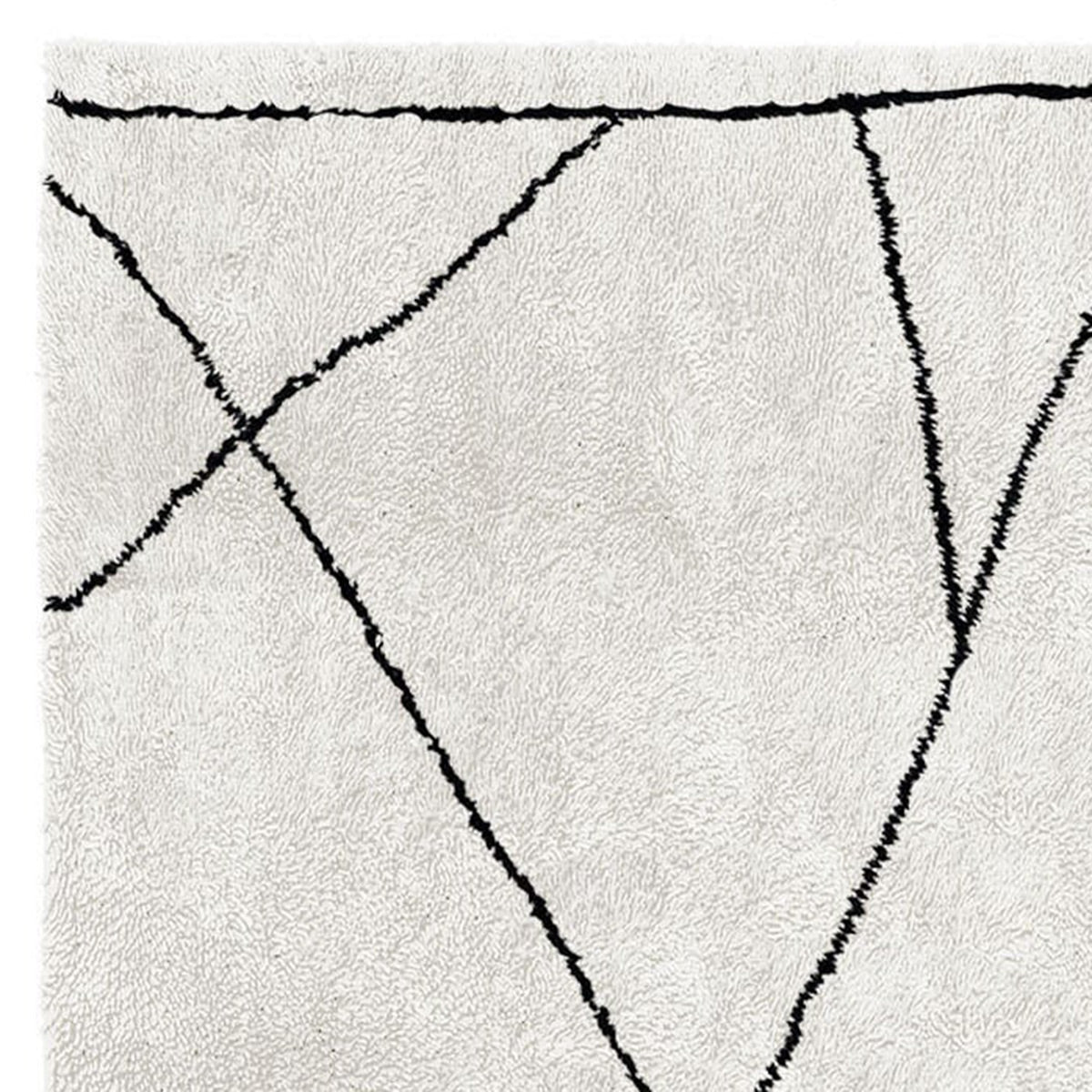 Bagnolo In Piano BO202 Rug by Second Studio, showing closeup view of bagnolo in piano bo202 rug by second studio in off white/grey & black.
