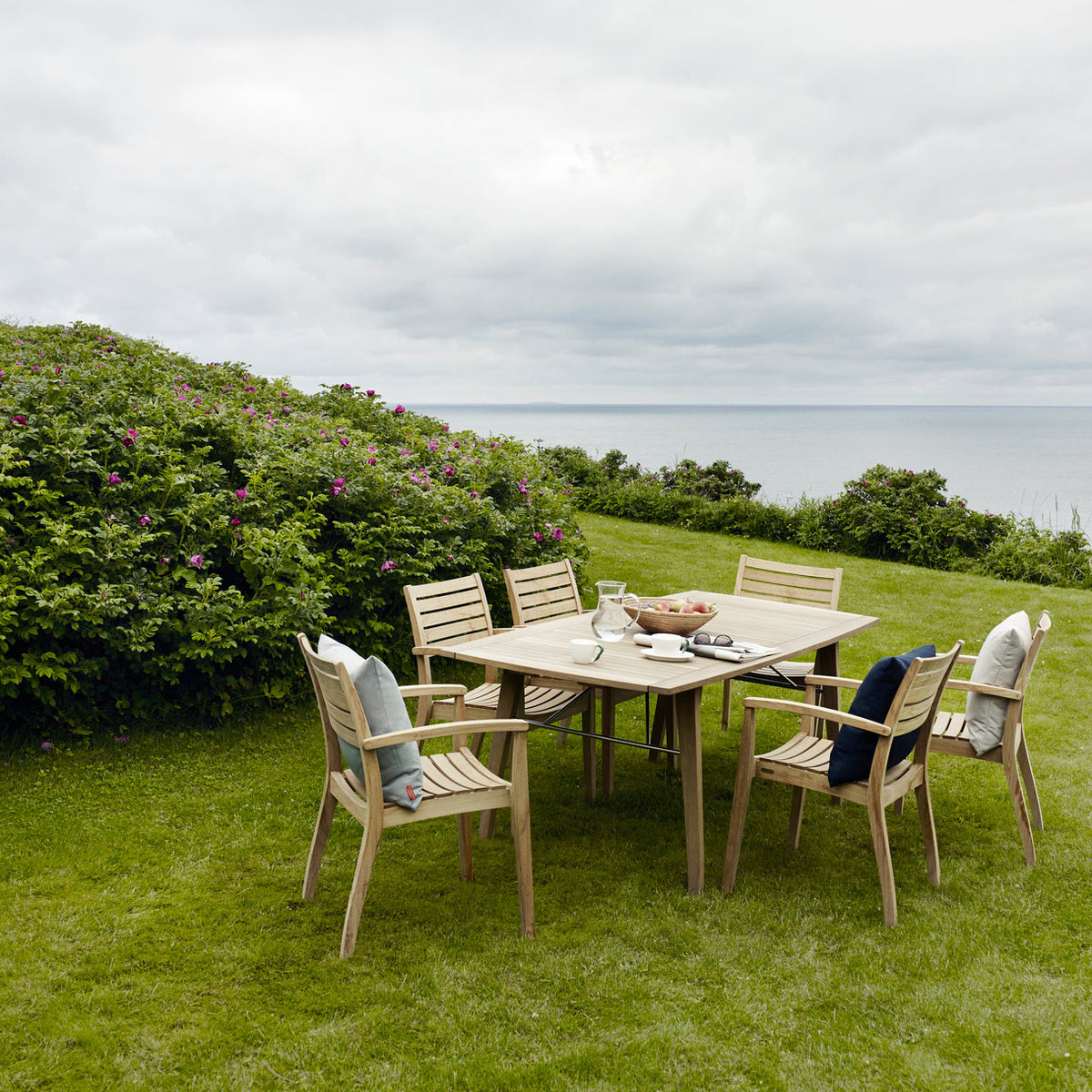 Ballare Chair by Skagerak, showing chairs with dining table in live shot.